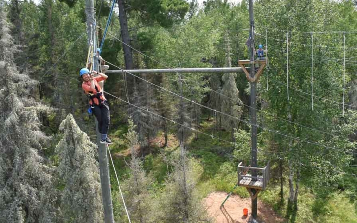 students make their way through a ropes course on an outward bound expedition 